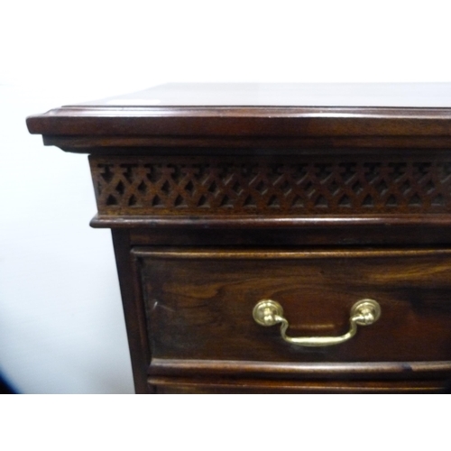 557 - Reproduction chest of four drawers on bracket feet.