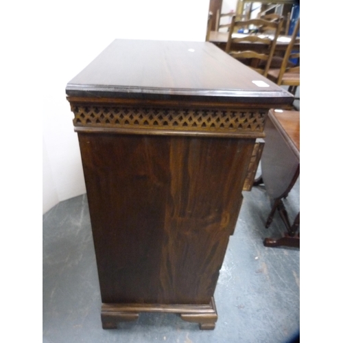 557 - Reproduction chest of four drawers on bracket feet.