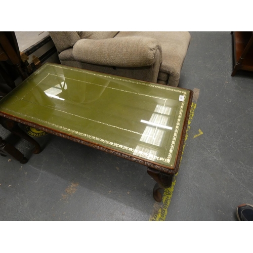 566 - Glass top coffee table.