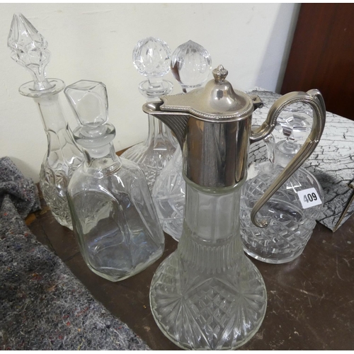 409 - Four cut glass decanters, carafe & ewer.