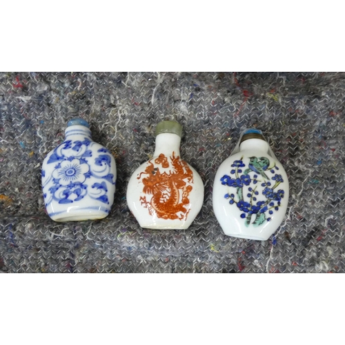 421 - Three modern Chinese snuff bottles, various patterns.