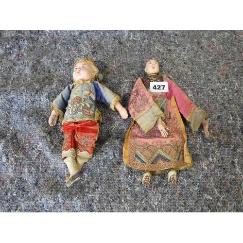 427 - Two antique Chinese dolls.