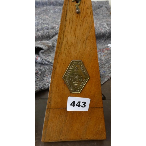 443 - Metronome in oak case.