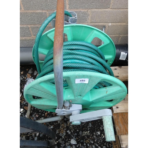 495 - Garden hose on reel. 