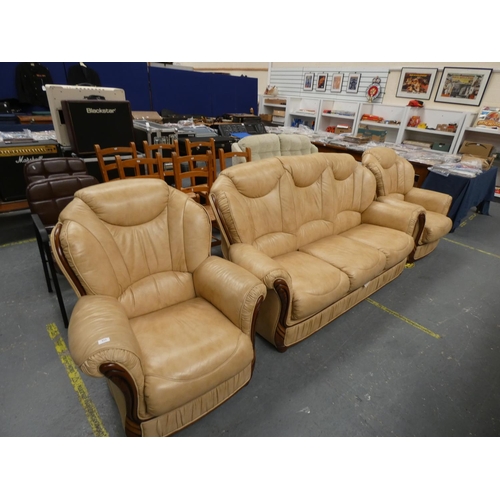 513 - Cream three seater sofa and two matching chairs.