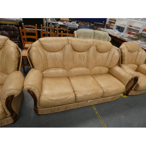 513 - Cream three seater sofa and two matching chairs.