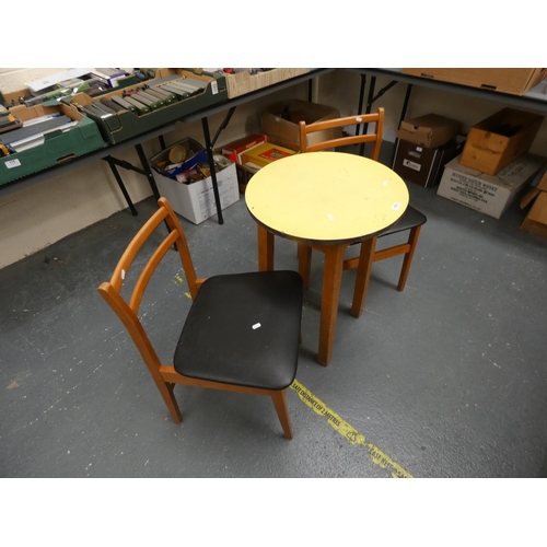 515 - Circular table and two chairs.