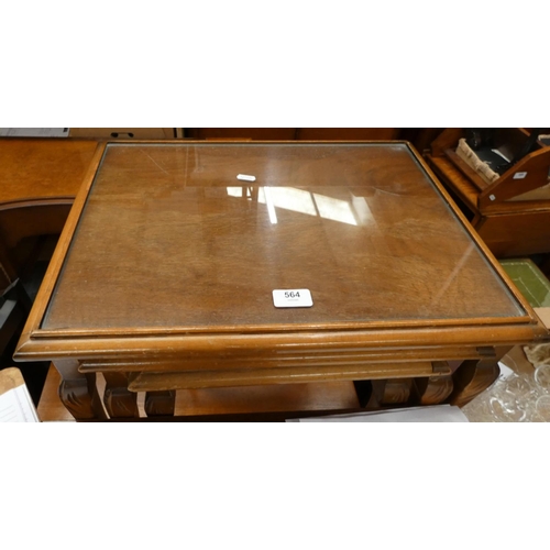 564 - Nest of three mahogany tables with inset glass tops.