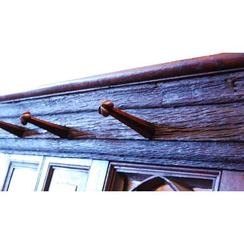 376 - English Arts & Crafts oak hallstand, with naturalistic cornice and five ornate pegs above a Goth... 