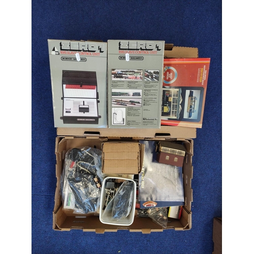 377 - Two boxes of model railway track components and scenery to include two boxed Hornby Zero 1 Slave Con... 