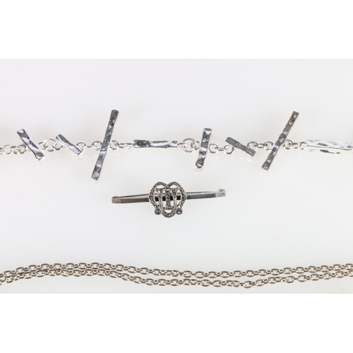 458 - Contemporary cast white metal bracelet in the manner of Tiffany, and a silver neck chain and three o... 