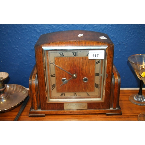 117 - Wooden cased mantel clock presented to F McPartlin.