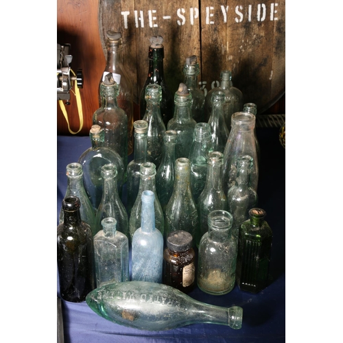 12 - Vintage glass bottles to include a torpedo shaped bottle for Schweppes, Aitken of Dunbar, Hendry's L... 