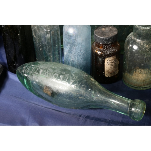 12 - Vintage glass bottles to include a torpedo shaped bottle for Schweppes, Aitken of Dunbar, Hendry's L... 