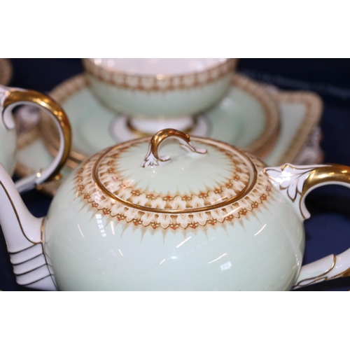 201 - Paragon Tudor teaset comprising teapot, hot water pot, cups, saucers, plates, jug, bowl, and a cake ... 