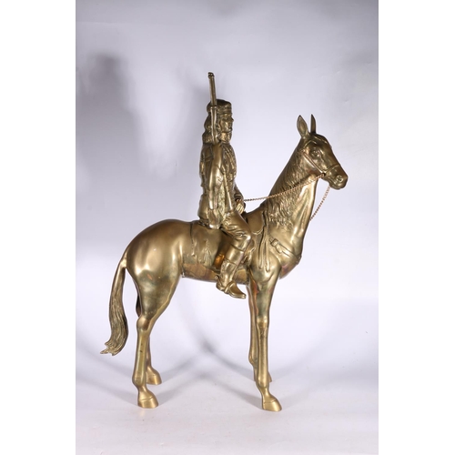 24 - Large brass Native American Indian on horseback model, 71cm high.