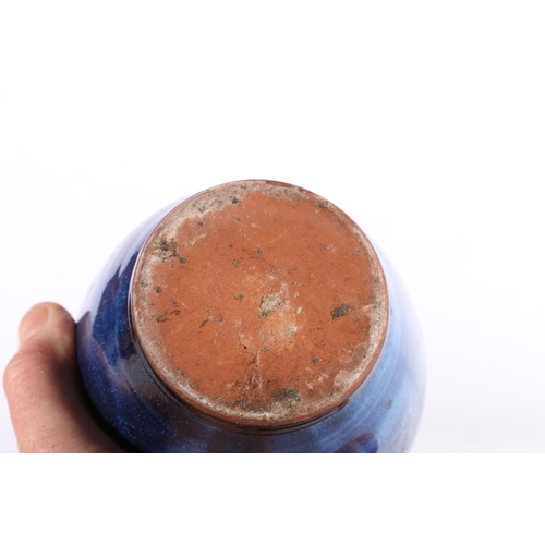 253 - Terracotta mottled blue glazed amphora style baluster vase, 16cm high.  (a/f)