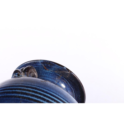 253 - Terracotta mottled blue glazed amphora style baluster vase, 16cm high.  (a/f)