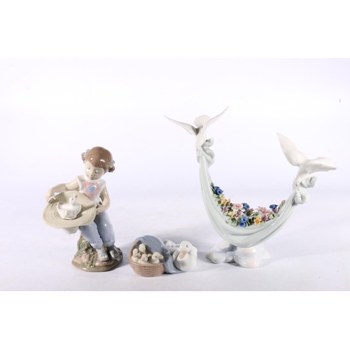 264 - Three Lladro figures, #6753 girl with straw hat and birds, 17cm high, #6579 birds with blanket of fl... 