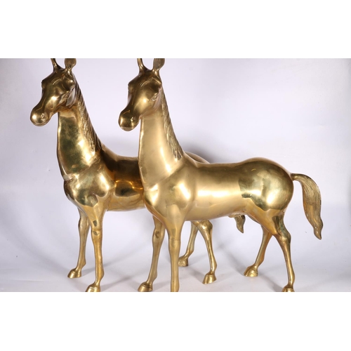 30 - Pair of large brass horse models, 58cm tall.