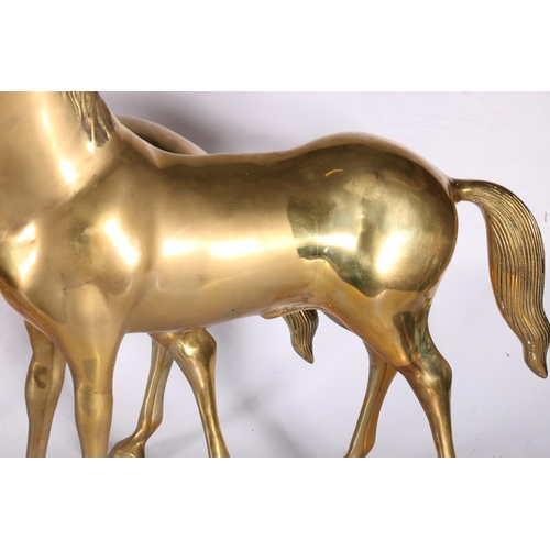 30 - Pair of large brass horse models, 58cm tall.