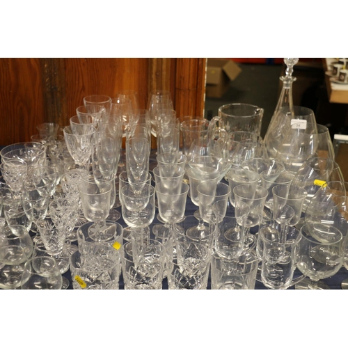 34 - Extensive group of glassware to include brandy balloons, whisky tumblers, a decanter, glasses, champ... 