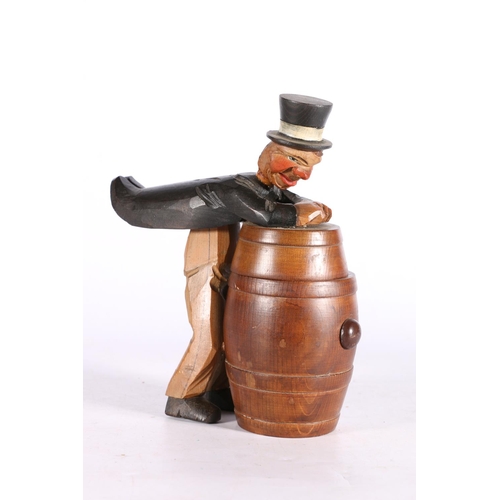 57 - Humorous novelty model of a man opening a barrel, paper label TFT.