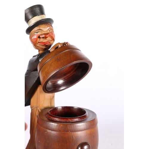 57 - Humorous novelty model of a man opening a barrel, paper label TFT.