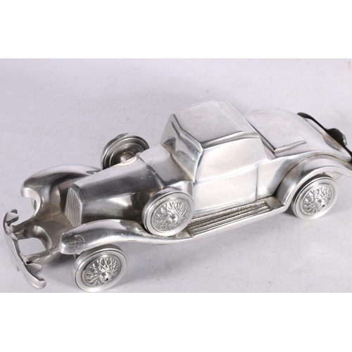 59 - White metal model of an car.