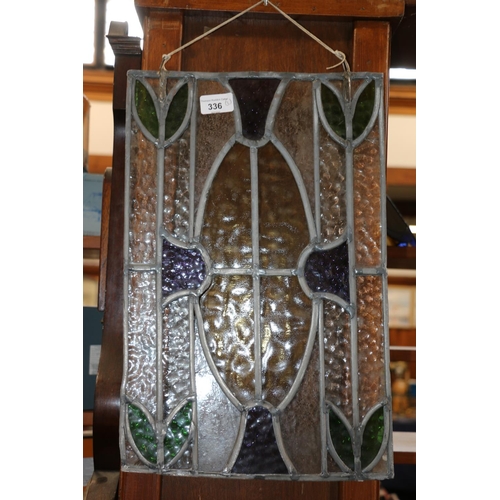 336 - Stained leaded glass panel, 45 x 30cm, a wall mirror with relief flower, 27 x 37cm, and a number 30 ... 