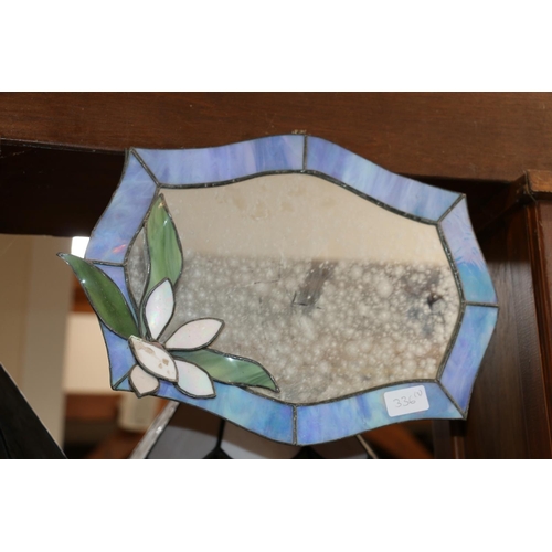 336 - Stained leaded glass panel, 45 x 30cm, a wall mirror with relief flower, 27 x 37cm, and a number 30 ... 