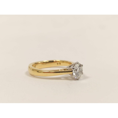 103 - Diamond solitaire ring with brilliant approximately .64ct, in 18ct gold and platinum, with report.