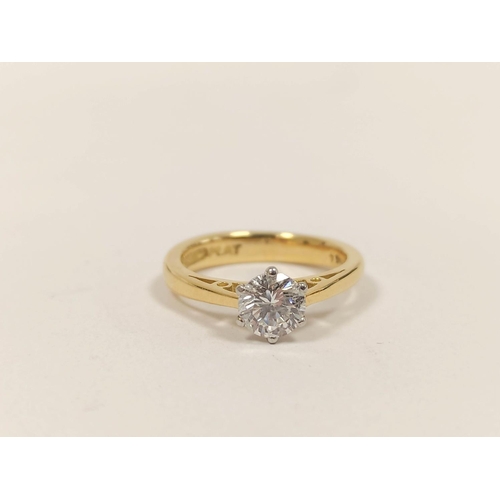 103 - Diamond solitaire ring with brilliant approximately .64ct, in 18ct gold and platinum, with report.