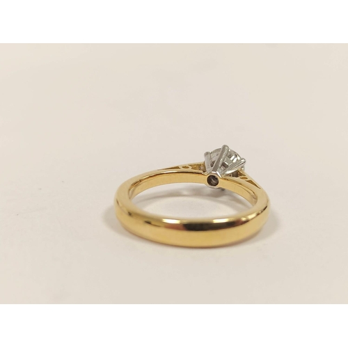 103 - Diamond solitaire ring with brilliant approximately .64ct, in 18ct gold and platinum, with report.