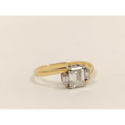 65 - Diamond three stone baguette ring, the largest approximately 10mm x 9mm, flanked by two others, in 1... 