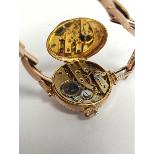 66 - Lady's 9ct gold cylinder watch, on expanding bracelet, 1928.