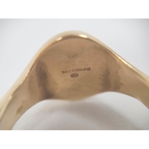 74 - 9ct gold signet ring, half engraved, 8.2g, size 'T'.