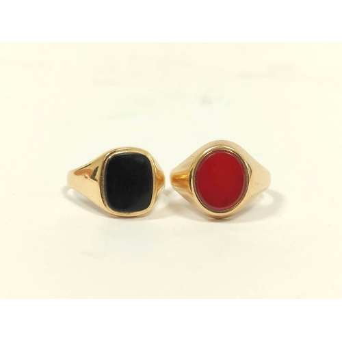 75 - 9ct gold signet ring, with oval carnelian, and another onyx, 7.5g gross, sizes 'U' and 'R'.