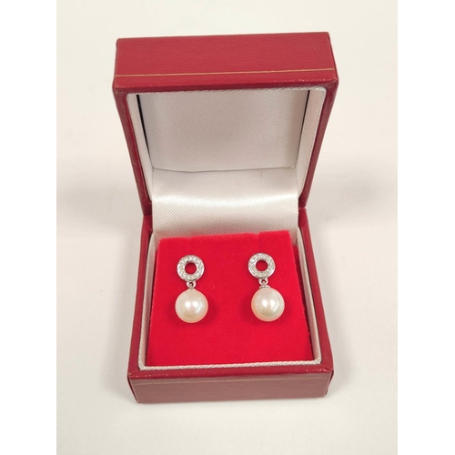 82 - Pair of pearl and diamond drop earrings, in 18ct white gold.