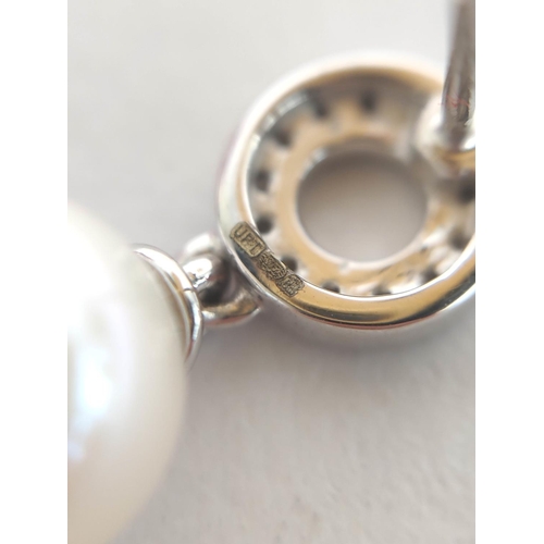 82 - Pair of pearl and diamond drop earrings, in 18ct white gold.