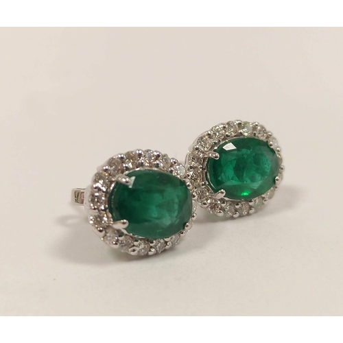 84 - Pair of emerald and diamond cluster ear studs, in 18ct gold.