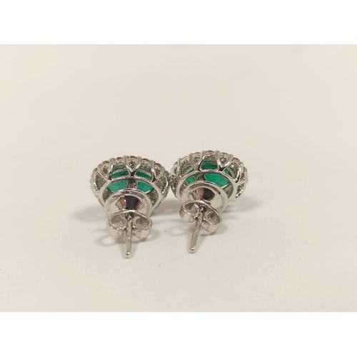 84 - Pair of emerald and diamond cluster ear studs, in 18ct gold.