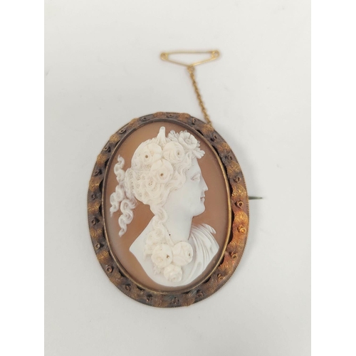 87 - Victorian shell cameo brooch, with portrait of woman in high relief, the gold mount with matted leaf... 