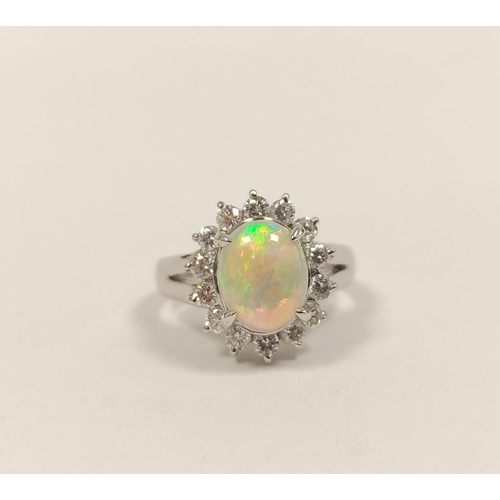 92 - Diamond and opal oval cluster ring, in 18ct white gold, size 'H'.