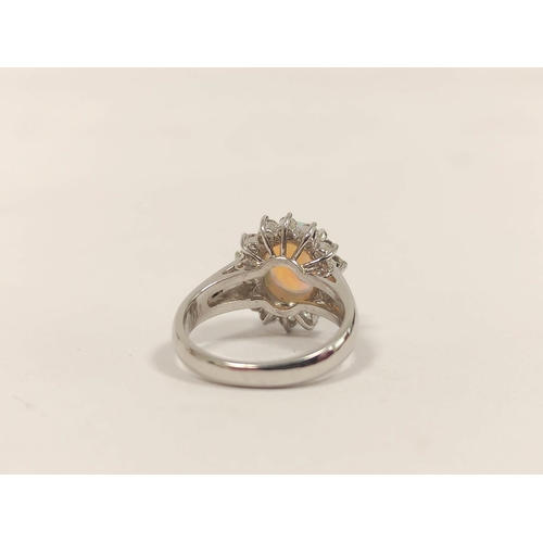 92 - Diamond and opal oval cluster ring, in 18ct white gold, size 'H'.