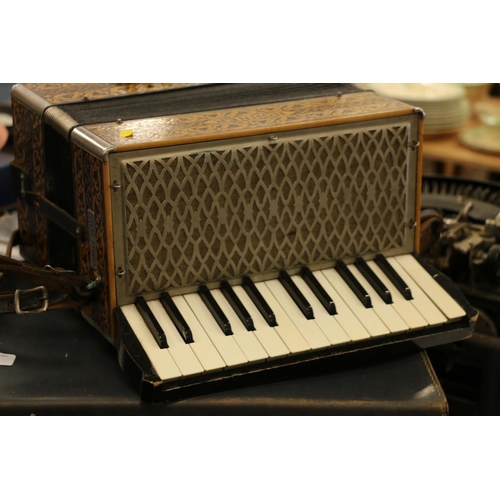 193 - Hohner accordion and travelling case.