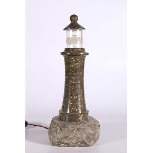 68 - Cornish serpentine table lamp in the form of a lighthouse, 29cm.