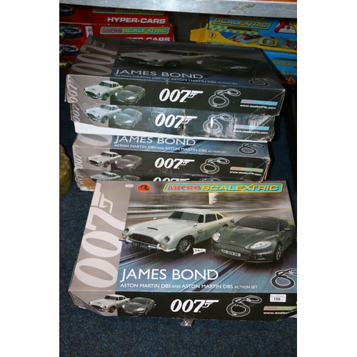 158 - Five boxes of 007 James Bond Scalextric.