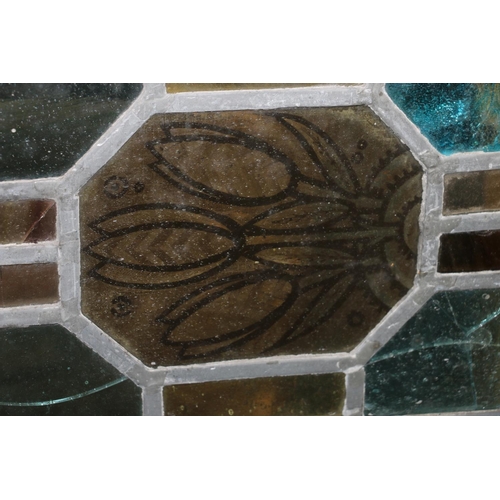 334 - Stained leaded glass panel, with central vignette depicting a bird, 30 x 80cm, and another with tree... 