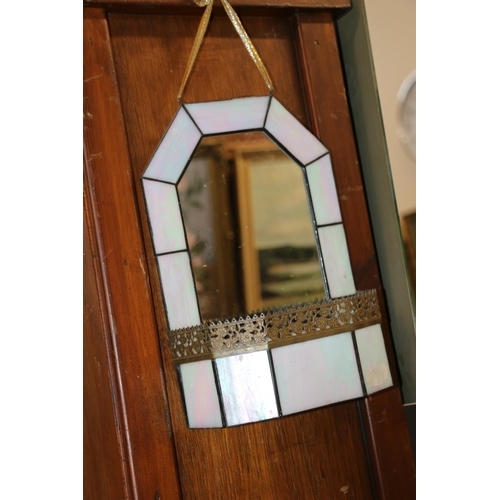 335 - Pair of stained leaded glass mirrored wall pockets, 28cm high, and a wall clock.